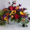 Our most popular container arrangement packed full of beautiful blooms in a