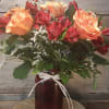 Turn the heat up with this mixed arrangement of roses and alstroemeria