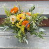This arrangement features a more wild, picked from the garden vibe with