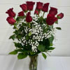 Celebrate love and elegance with long-stem Red Roses, beautifully arranged in a