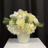 This white winter mix of texture flowers and green foliage will be