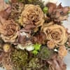 A textured arrangement of beige toned blooms