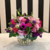 A variety of pink and purple flowers fill our beautiful bubble bowl