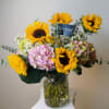 A bouquet that radiates both strength and elegance. Featuring 10 golden sunflowers