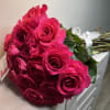 A fresh bouquet of hot pink roses, with no wrapping paper, preserving