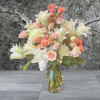 Beautiful oriental lilies. Desirable shades of pink spray roses. With exquisite hydrangeas.