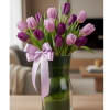 Purple tulips symbolize royalty, elegance, and admiration. This bouquet carries a message