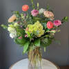 A beautiful, tall and showy arrangement in shades of pink and blush