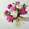 We gather the prettiest peonies and wrap them with foliage and hand