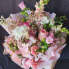 Feminine, Romantic and Pure bliss! The bouquet is wrapped in pink ruffled