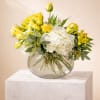 A bright and refined arrangement featuring radiant yellow roses, lush white hydrangeas