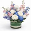 The Blue Belle is an elegant, garden-inspired floral arrangement featuring lush blue