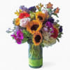 Lovely roses orchids, sunflowers and more arranged tall in a modern glass