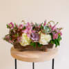This unique arrangement features a lush collection of long-lasting flowers, such as