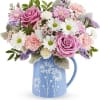 Like a gentle breeze across a spring meadow, the Pastel Meadow Bouquet