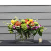 This modern vase is anything but ordinary. Arranged with protea, hydrangeas, and
