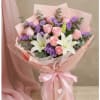 Delight in the beauty of our bouquet, featuring elegant  lilies and