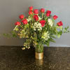 12 long stem red roses arranged in a designer gold bottomed vase