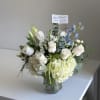 All white arrangement with light touch of baby blue