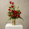 A luxurious twist on the classic red dozen, this upscale arrangement redefines