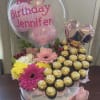 basket with flowers and chocolate