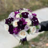 Purple explosion in this beautiful round natural bouquet.
