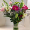 Asiatic Lilies, Gerbera Daisies, Snapdragons, Solidago, Roses, Assorted Fancy Greens.