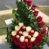 22 red and white roses and greens with 6 Ferrero Rocher are