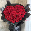 A heart-shaped arrangement of classic red roses, thoughtfully designed to express love