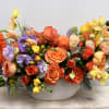 Sweetley hued, this graceful arrangement includes a mix of seasonal spring time