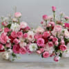 Wow, wow, wow! This grand masterpiece showcases garden roses, peonies, ranunculus, and