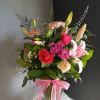 A beautifully winter floral arrangement of the freshest flowers in a vase