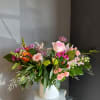 A beautifully selected bunch of the freshest flowers in a gold container