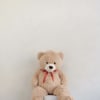 A cuddly brown teddy bear with ultra-soft plush fur and a classic