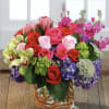 This jaw-dropping arrangement is filled to the brim with bright Spring flowers