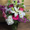 A beautiful mix of hydrangeas, gerbera daises, mums, stock, and lilies