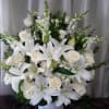 This arrangement is a grand expression of love. Elegant white flowers and