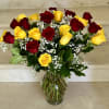 24 Yellow and Red Roses arranged in a vase