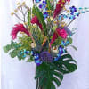 A South Beach Style Tropical Arrangement. The quantity of flowers increase with