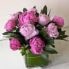 Peonies arranged in a glass vase vase with greenery.
Standard:  10 Peonies