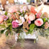 Soft pastels in pinks, peaches and lavender designed in a garden theme