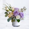 A graceful study in softness and form, this elegant arrangement blends premium