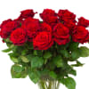 The classic dozen, long stemmed, red roses, arranged in a cylinder vase