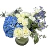 Blue hydrangea, white roses, white spray roses, blue delphinium, blue thistle and