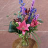A colorful arrangement consisting of tropical flowers.