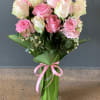 A beautiful mixture of shades of pink roses arranged in a tall