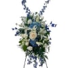 A beautiful sympathy standing spray, designed with fresh, elegant blooms in soft
