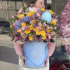 Introducing our Easter Delight Floral Arrangement, a whimsical and festive display that