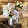 ..white roses, tulips, phaelopsis blooms with touch of green in a elegant