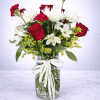 A striking mix of red roses, white spider mums, carnations, and delicate